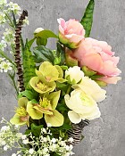 Black swirl glass vase with Peonies, Ranunculus and Hellebores