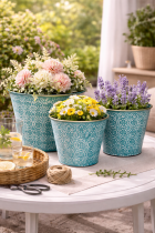 Teal planters with vibrant blooms