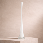 Elegant white glass vase on stone