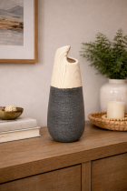 Modern vase on wooden sideboard