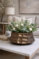 Decorative bronze bowl with floral arrangement