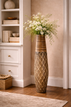 Decorative vase and minimalist bookshelf arrangement