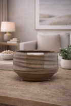 Ceramic bowl on wooden surface