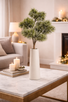 Minimalistic pine centerpiece on marble table