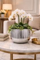 Elegant planter with orchids and decor