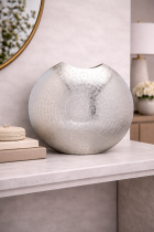 Decorative silver vase on marble table