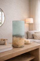 Ombre glass vase on sideboard