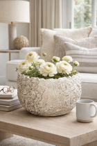 Textured bowl with flowers and moss