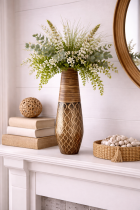 Elegant vase with greenery on mantel