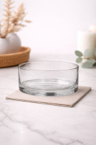 Clear glass bowl on marble countertop