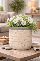 Textured stone planter with white blooms