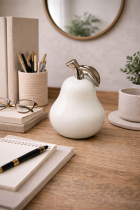 Still life with pear and desk items