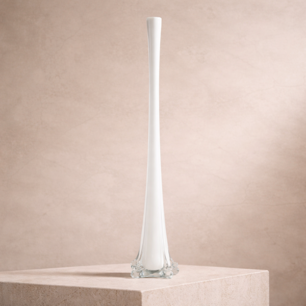 Elegant white glass vase on stone
