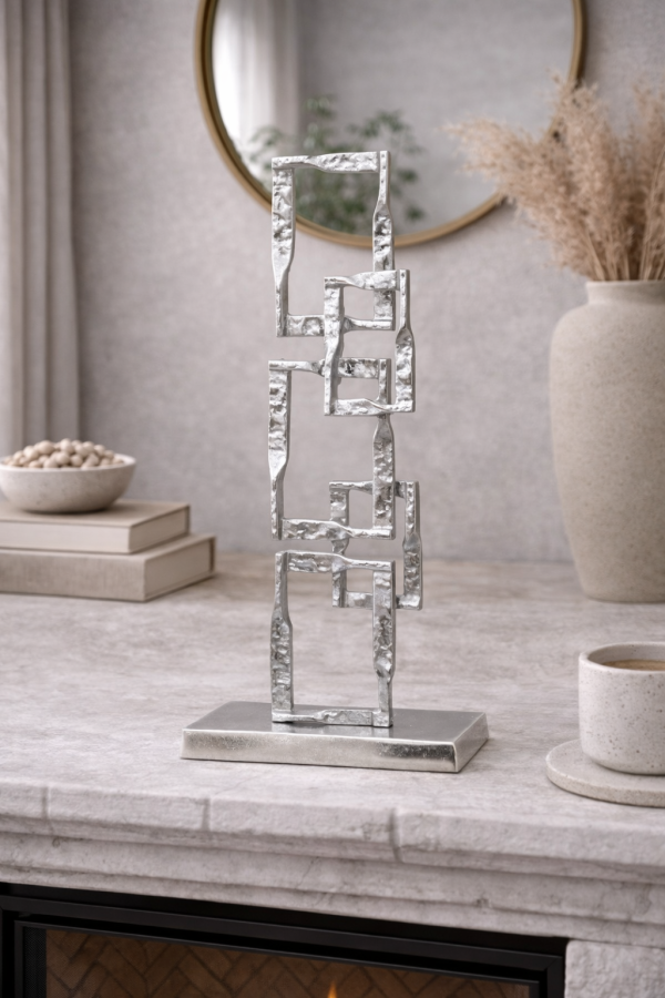 Geometric sculpture on stone mantel