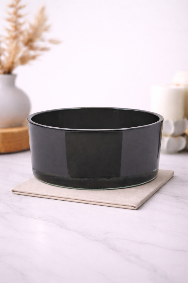 Dark grey glass bowl on marble