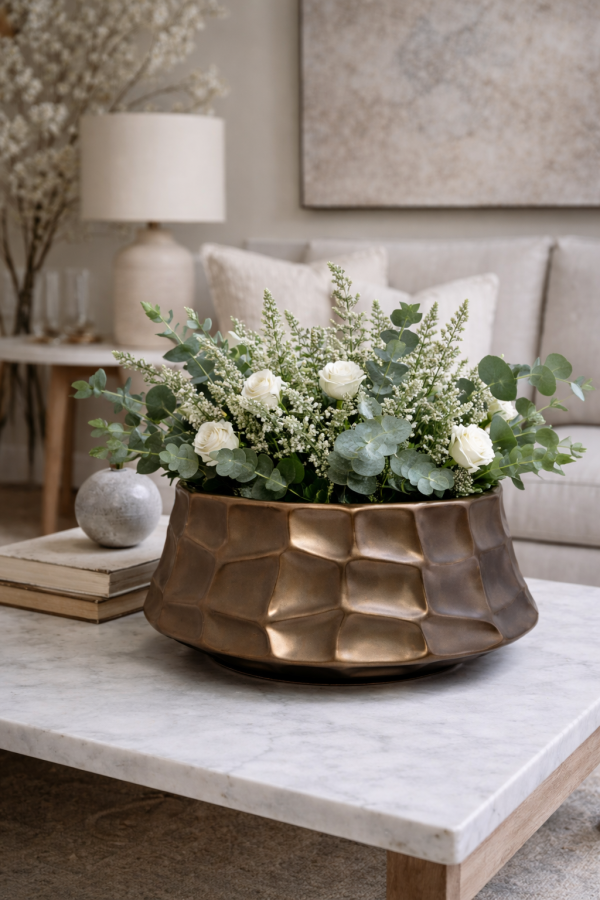 Decorative bronze bowl with floral arrangement