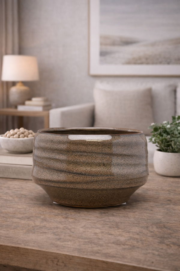 Ceramic bowl on wooden surface