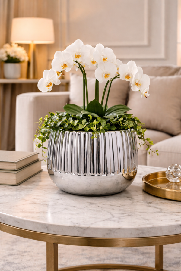 Elegant planter with orchids and decor