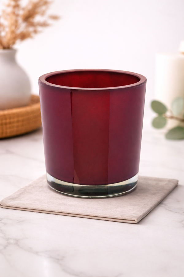 Red glass vase on marble countertop